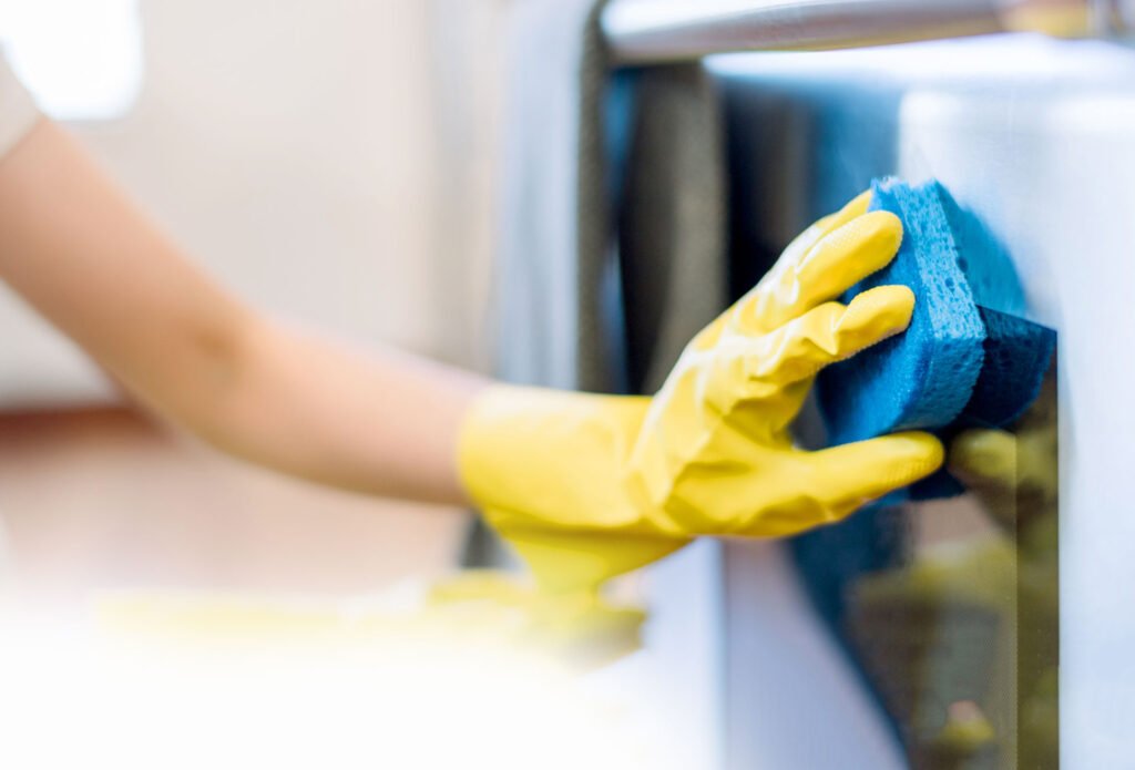 Home Cleaning woman cleaning a kitchen